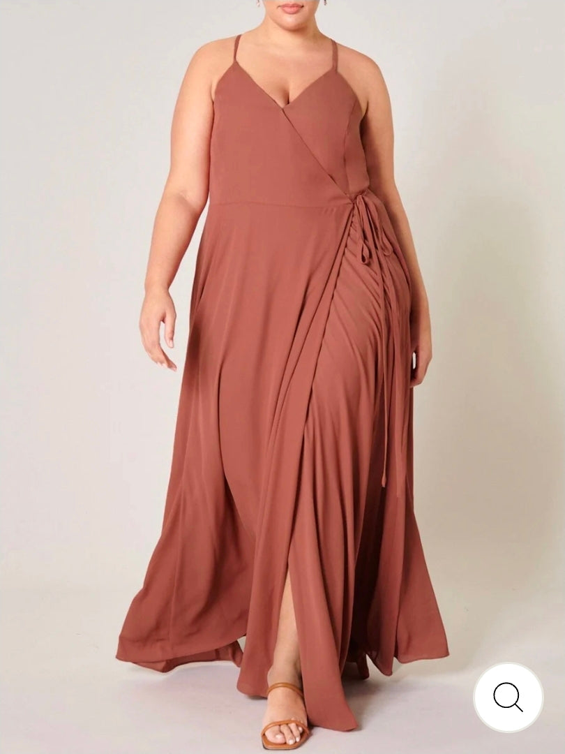 This plus size sleeveless surplice open back maxi dress.