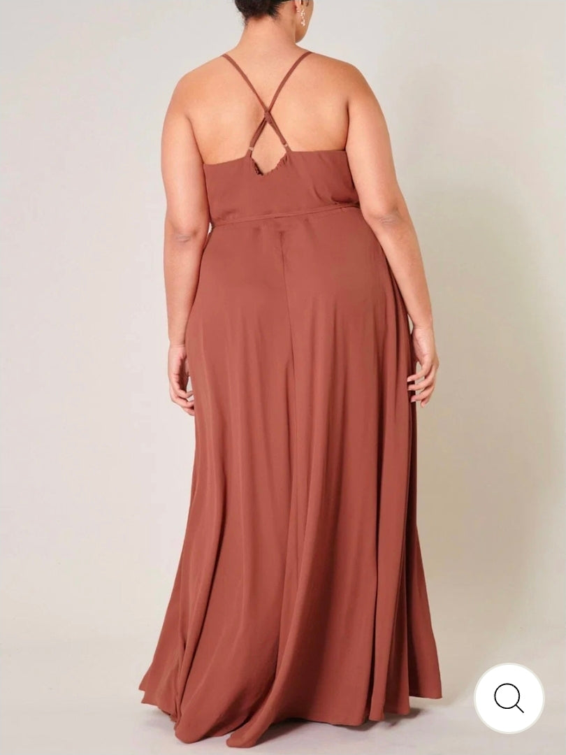 This plus size sleeveless surplice open back maxi dress.